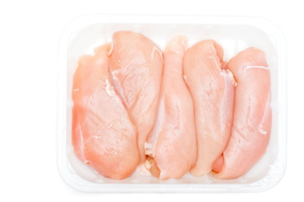 Chicken breasts against white background ( series)