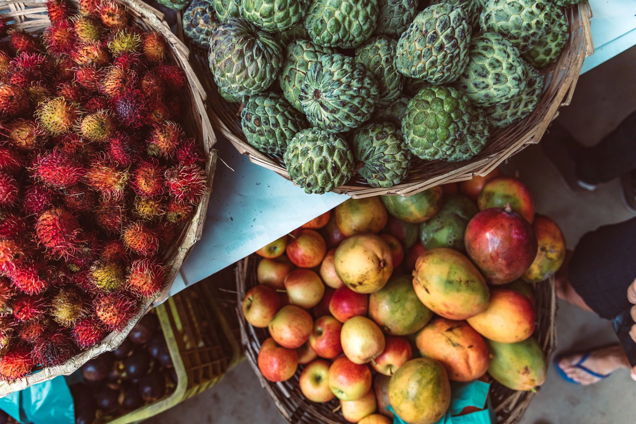 Overhead view of assorted fruits in baskets